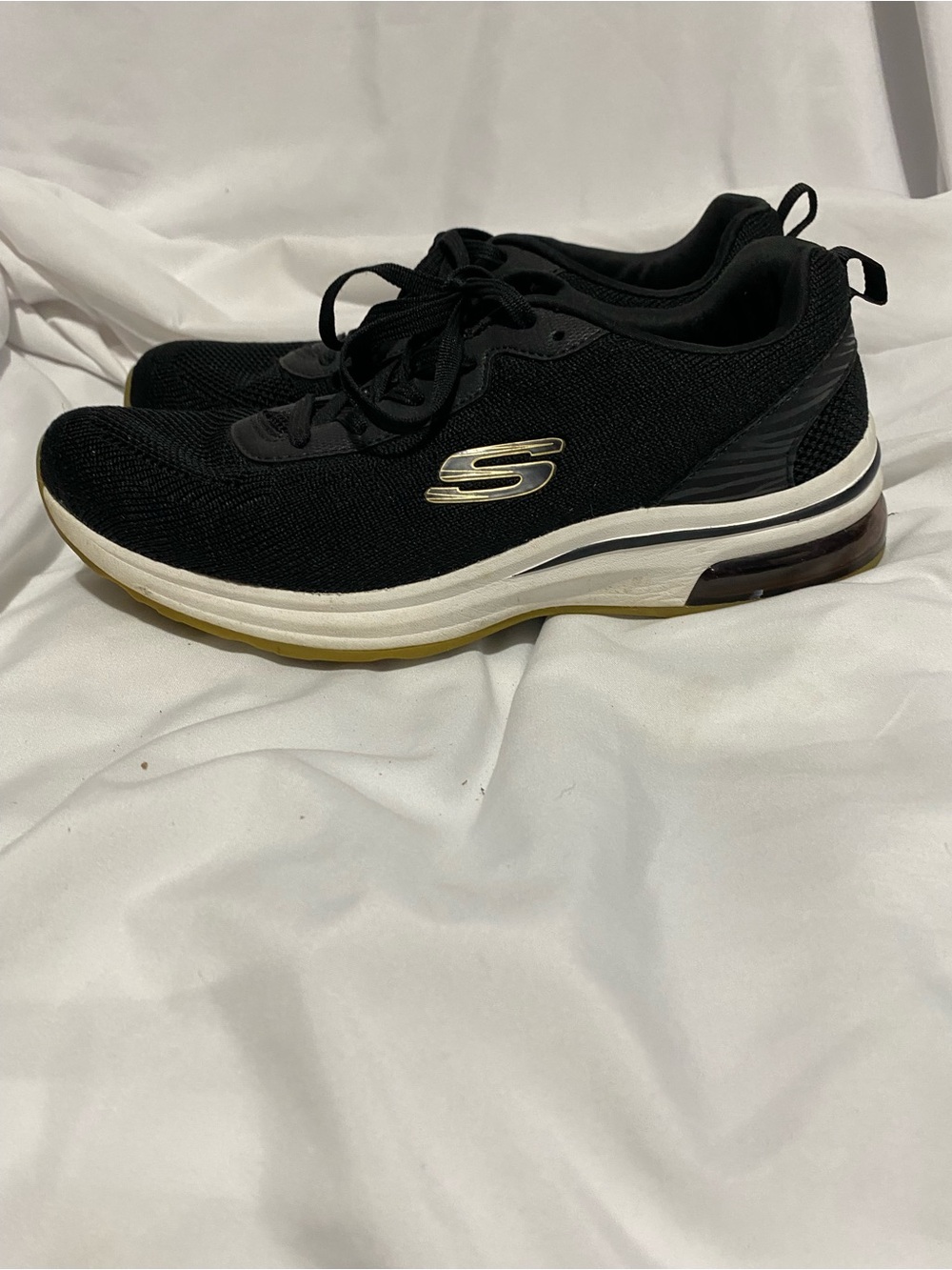 Skechers Women's Black Knit Sneakers with White Midsole and Gold Logo